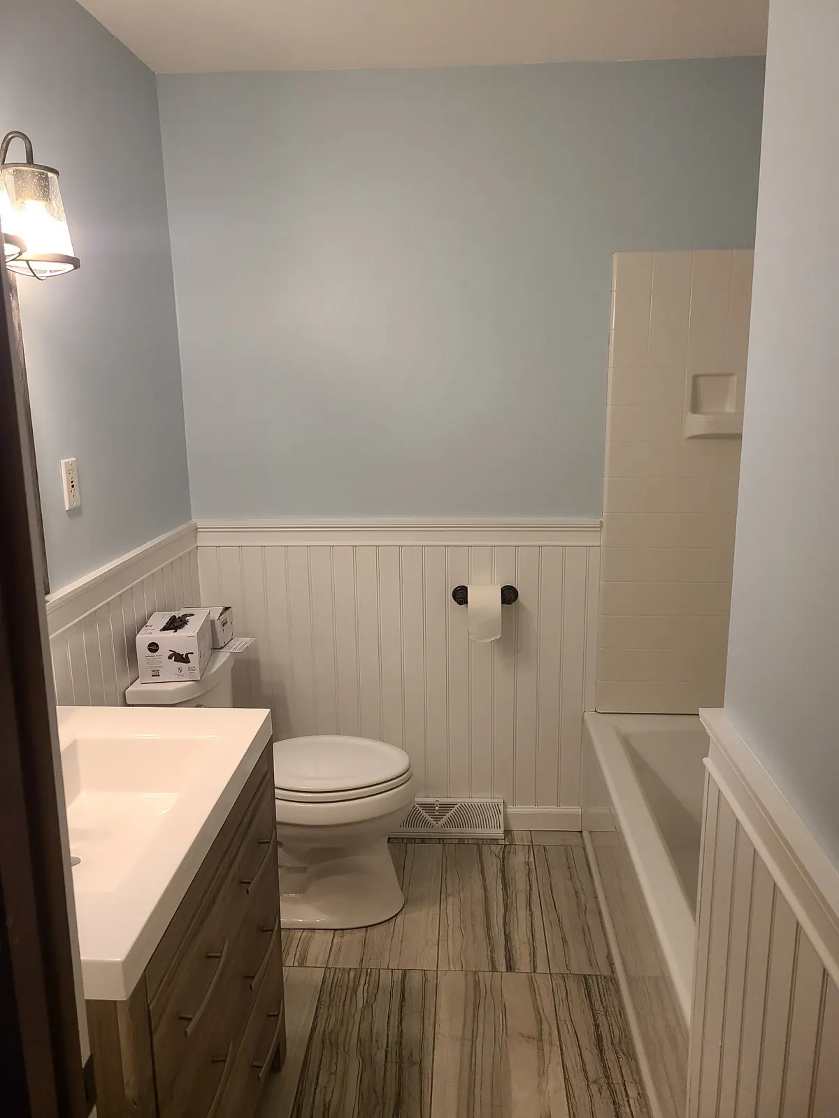 Bathroom with beadboard wainscot and new vanity